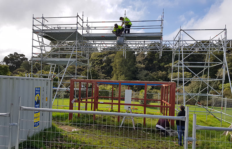 Safety net rigged beneath a timber-framed roof structure